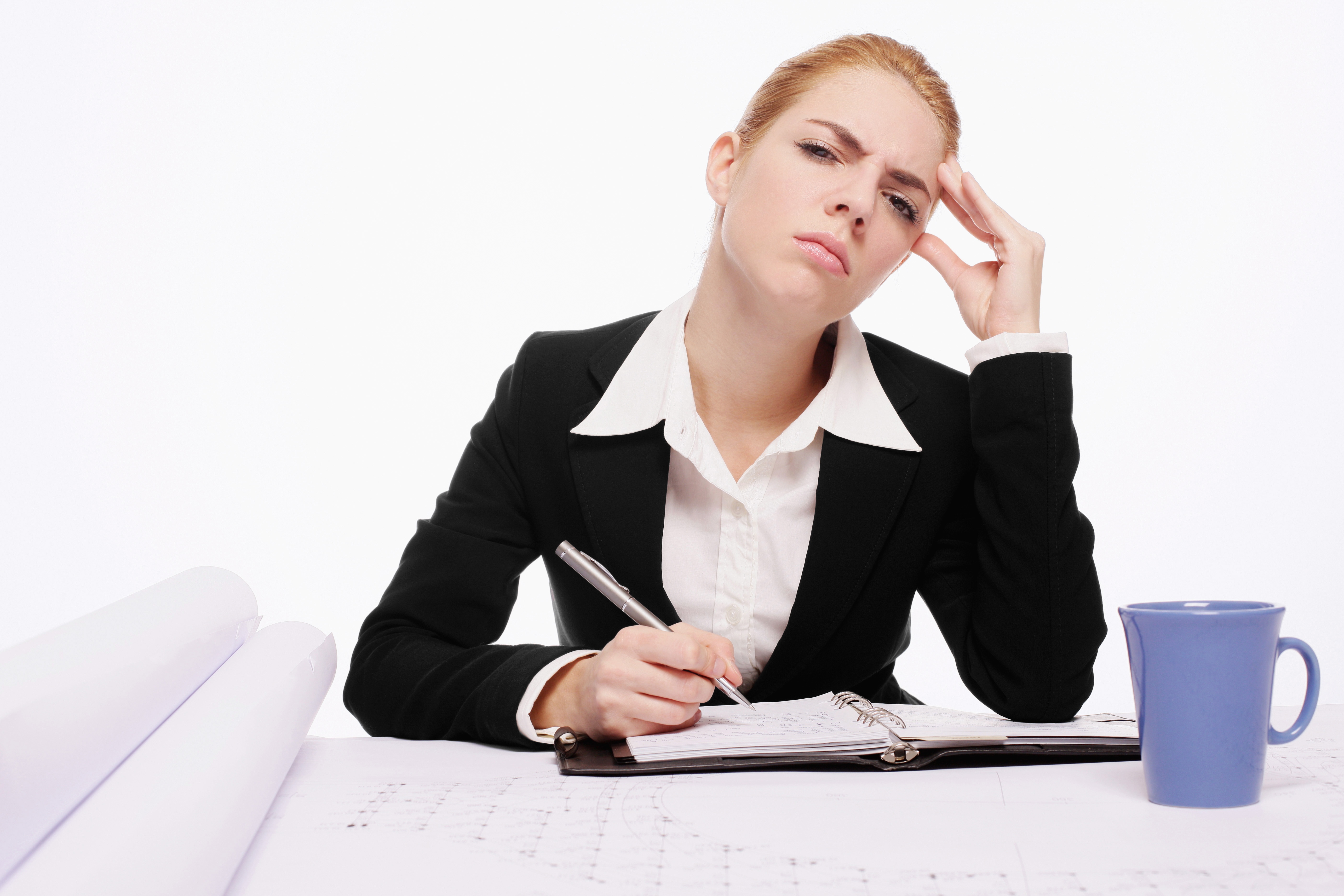 Business woman cringing and rubbing her temple