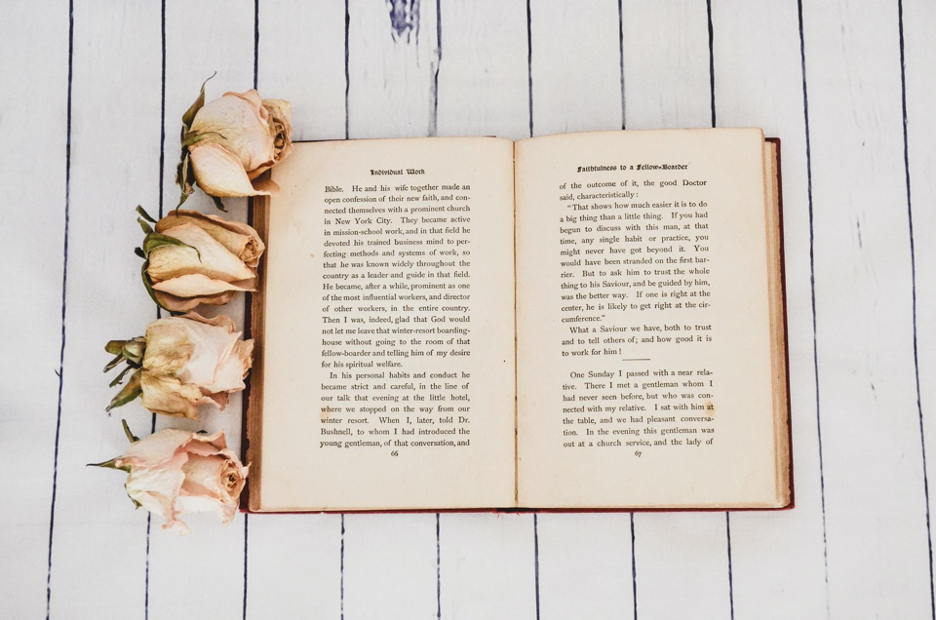 an open book on a wooden table